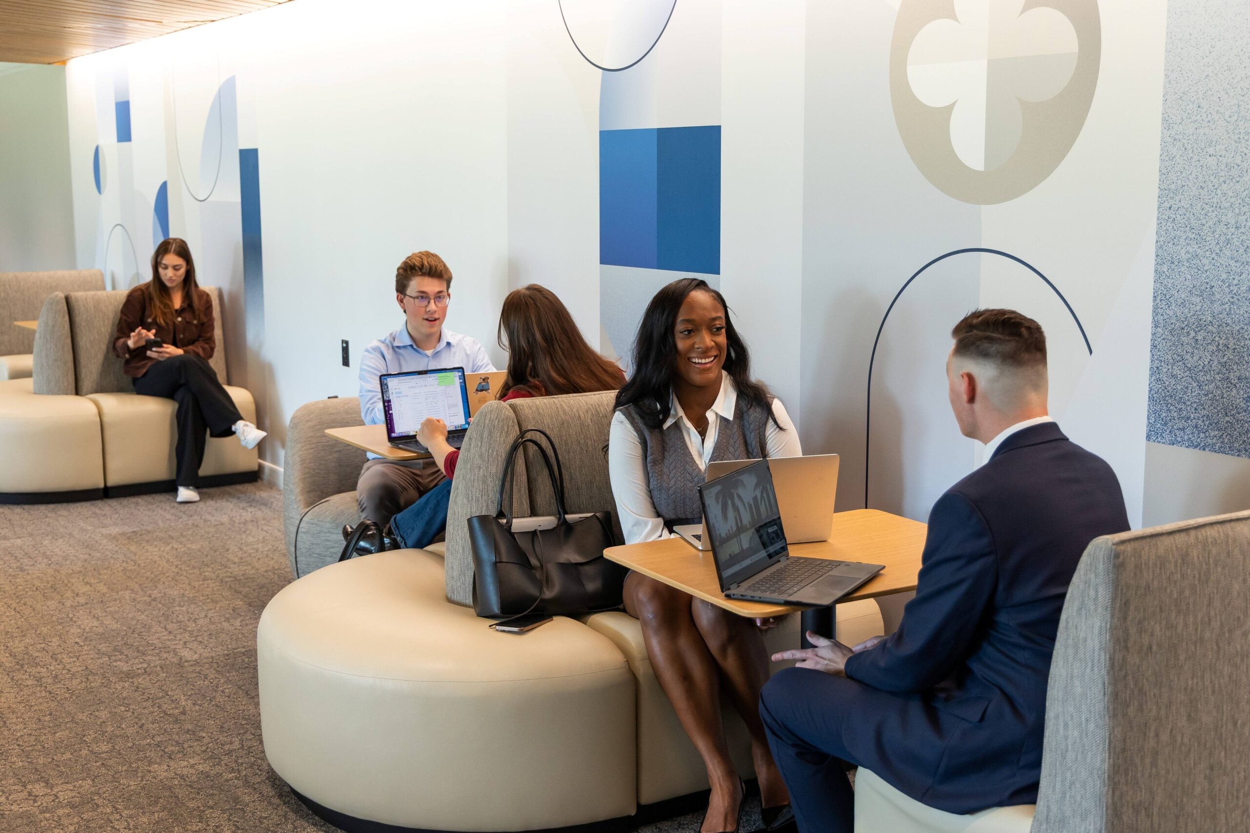 Students sitting at booth style tables and talking
